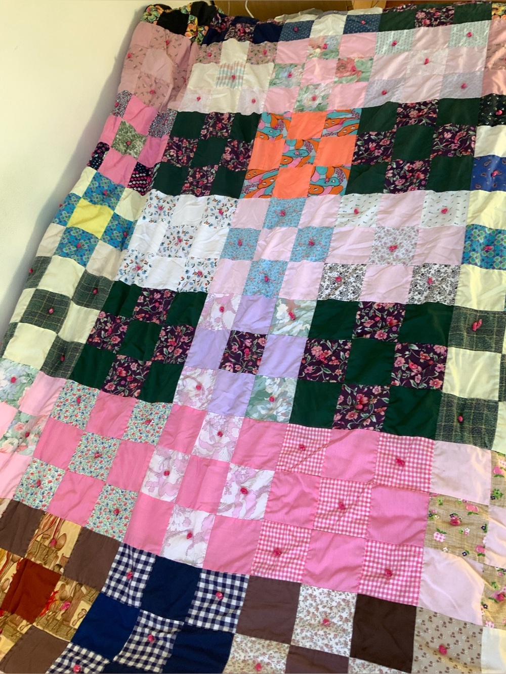 handmade patchwork quilt pink colourful yarn ties